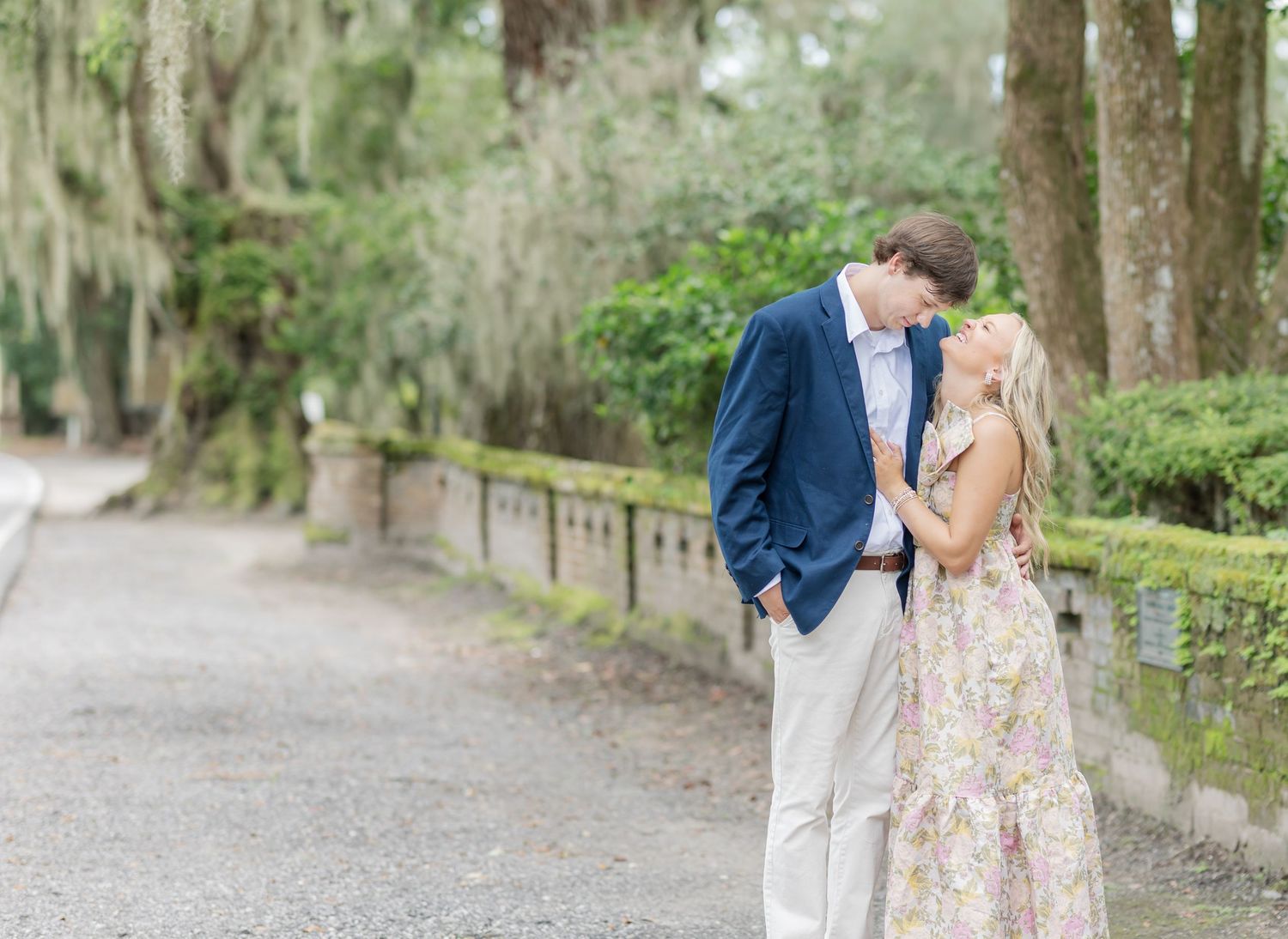 A romantic photo series showing a couple walking and embracing on a garden pathway.