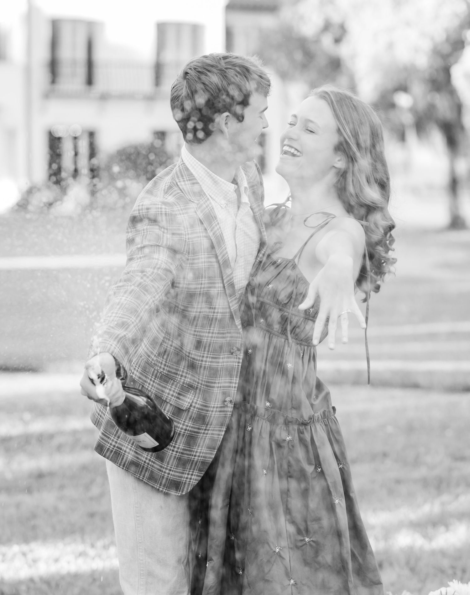 A black and white photo series shows a couple in plaid embracing outdoors in a candid romantic moment.