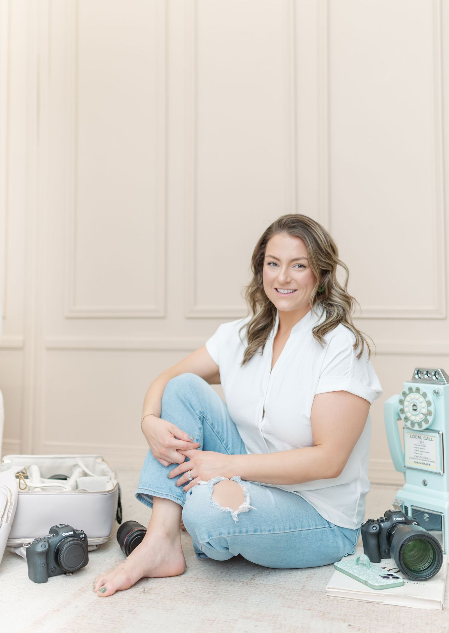 Lifestyle photography series showing casual poses against white wall with vintage camera and teal accents.