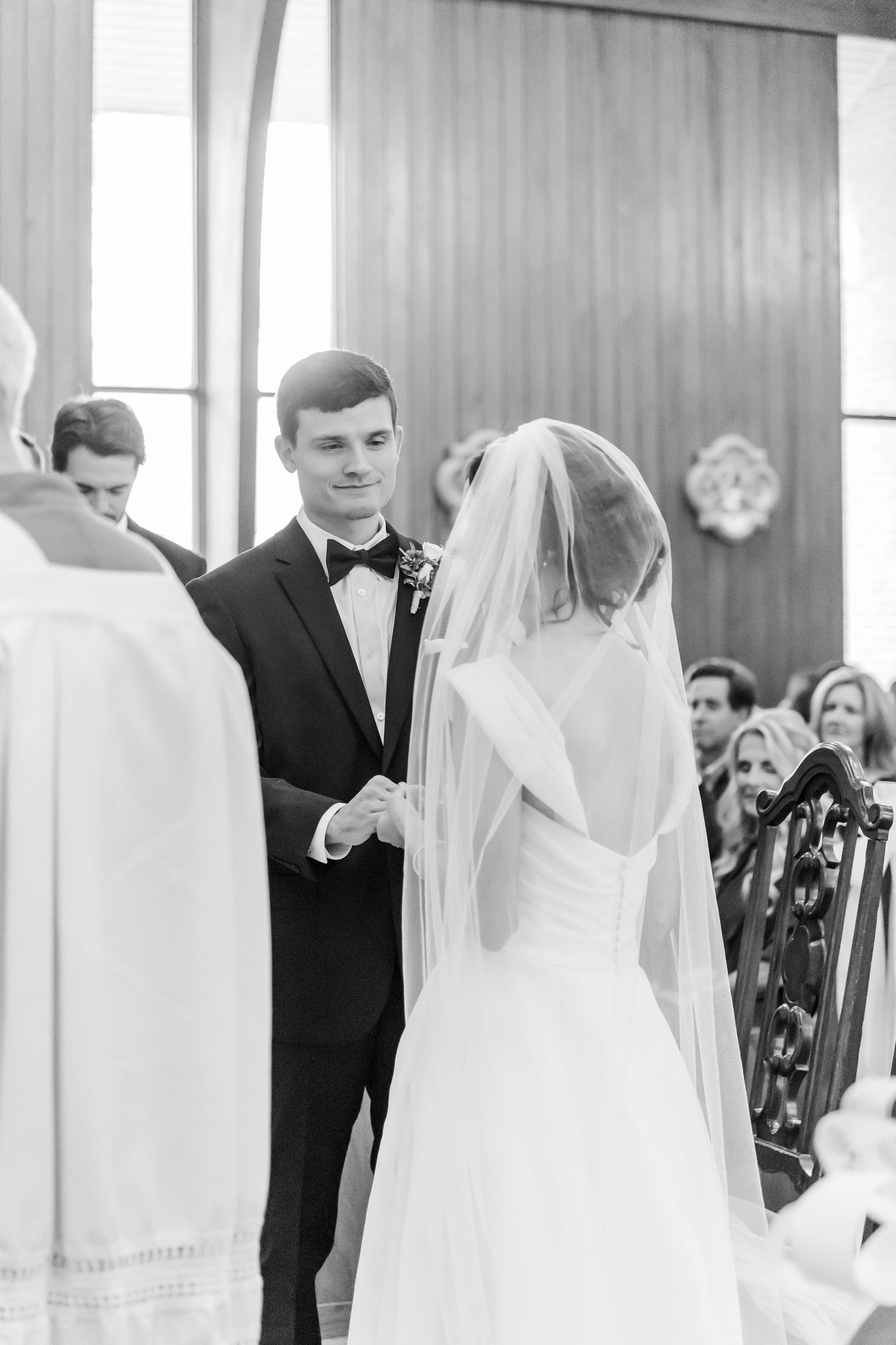 Black and white photos of wedding ceremony inside traditional church.