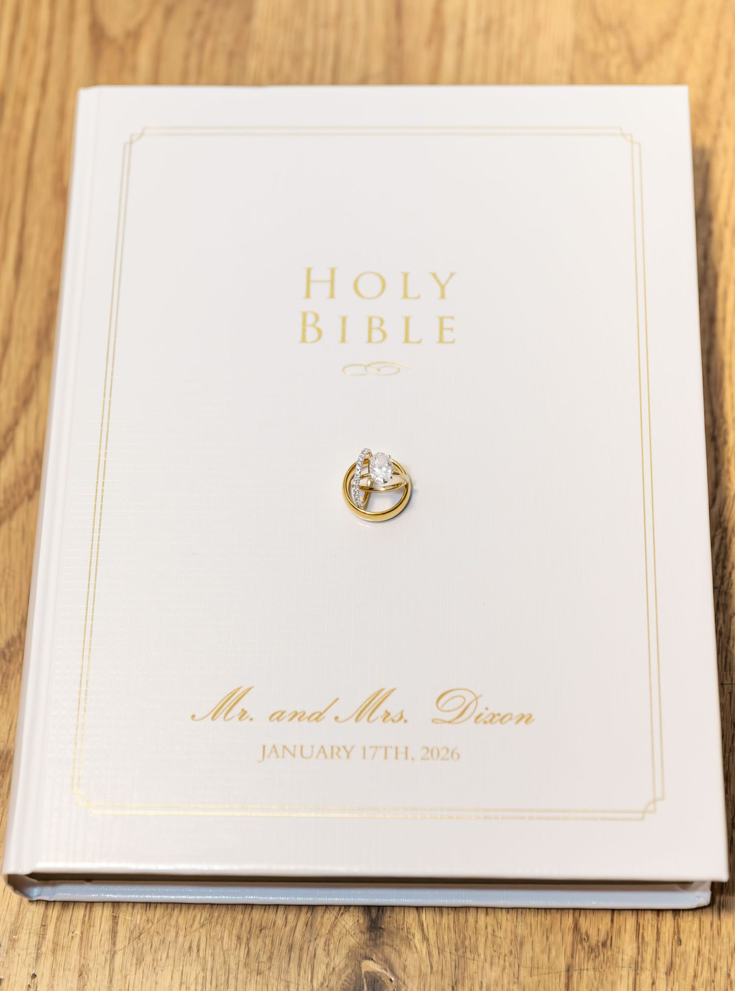 Personalized white Holy Bible with gold rings emblem for Mr. and Mrs. Dixon, January 17th, 2026.