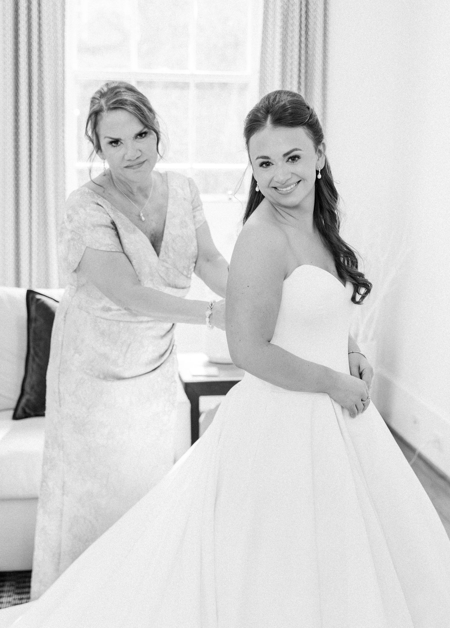 A series of bridal preparation photos showing a bride getting ready in a white wedding gown by a bright window.