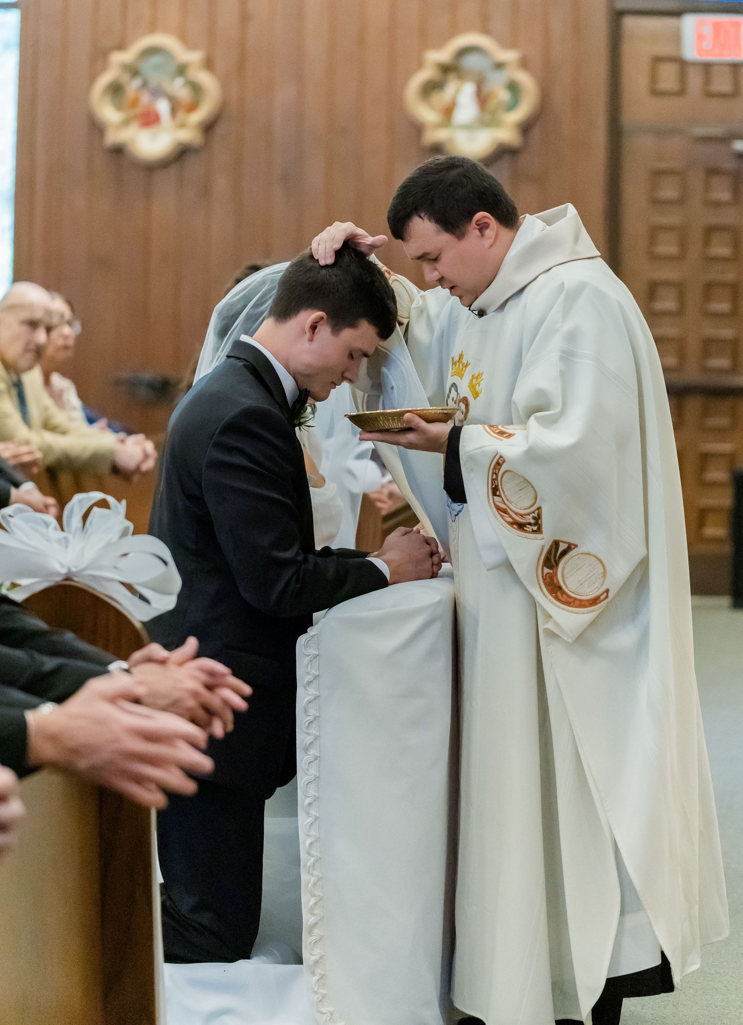 A sequence of photos showing a priest blessing a kneeling person during a religious ceremony.