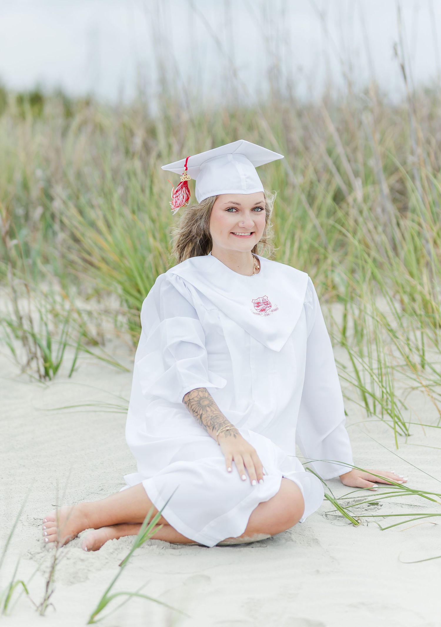 Artistic beachwear photography session among natural sand dunes and sea grass.