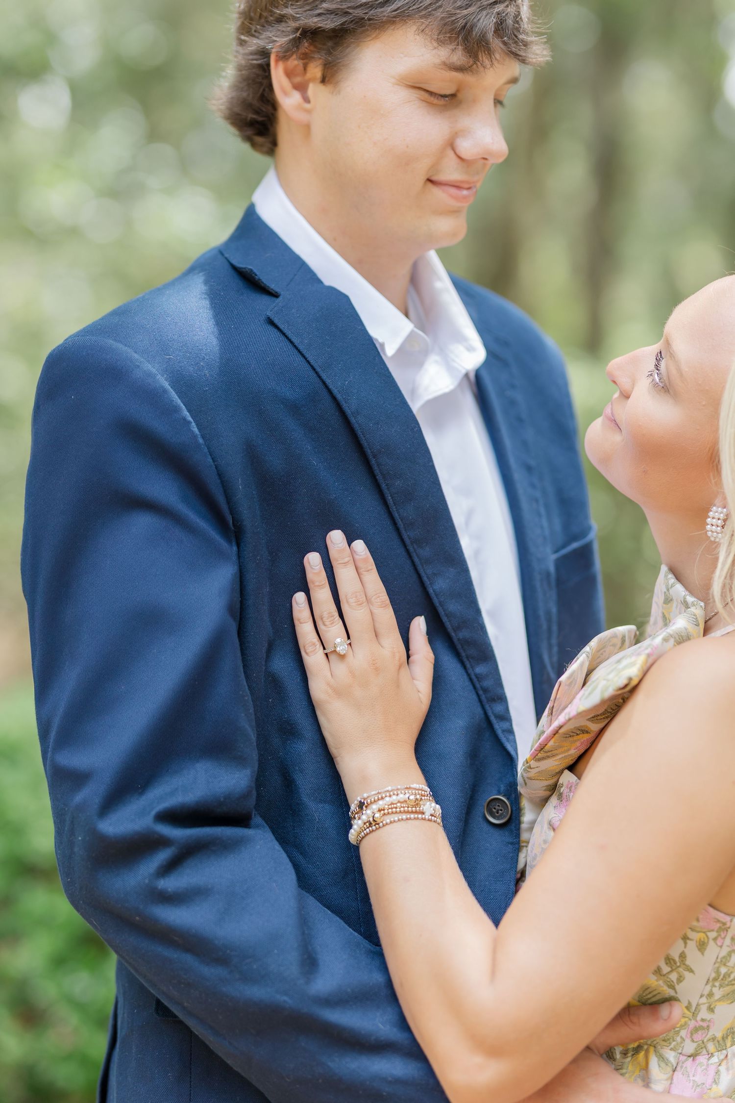 Romantic wedding portrait series showing tender moments between newlyweds in a natural outdoor setting.