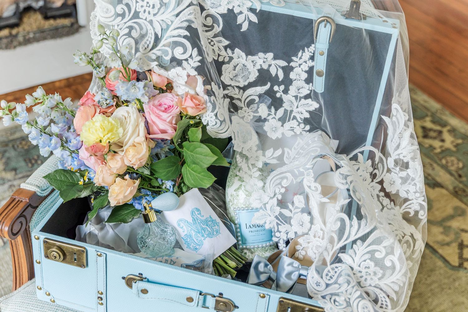 Elegant wedding decor featuring delicate floral arrangements and lace details on tables with soft lighting.