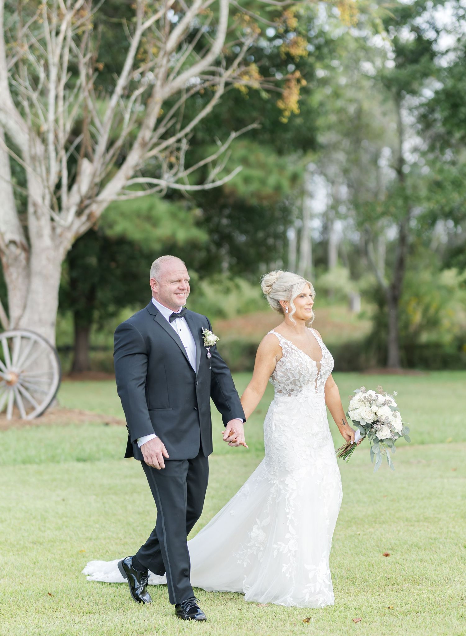 A series of wedding photos showing a couple walking together on a grassy lawn surrounded by tall trees.