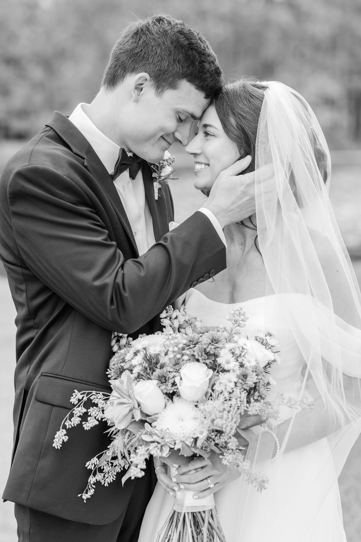 Black and white wedding photo series showing intimate moments between newlyweds with elegant floral bouquet.