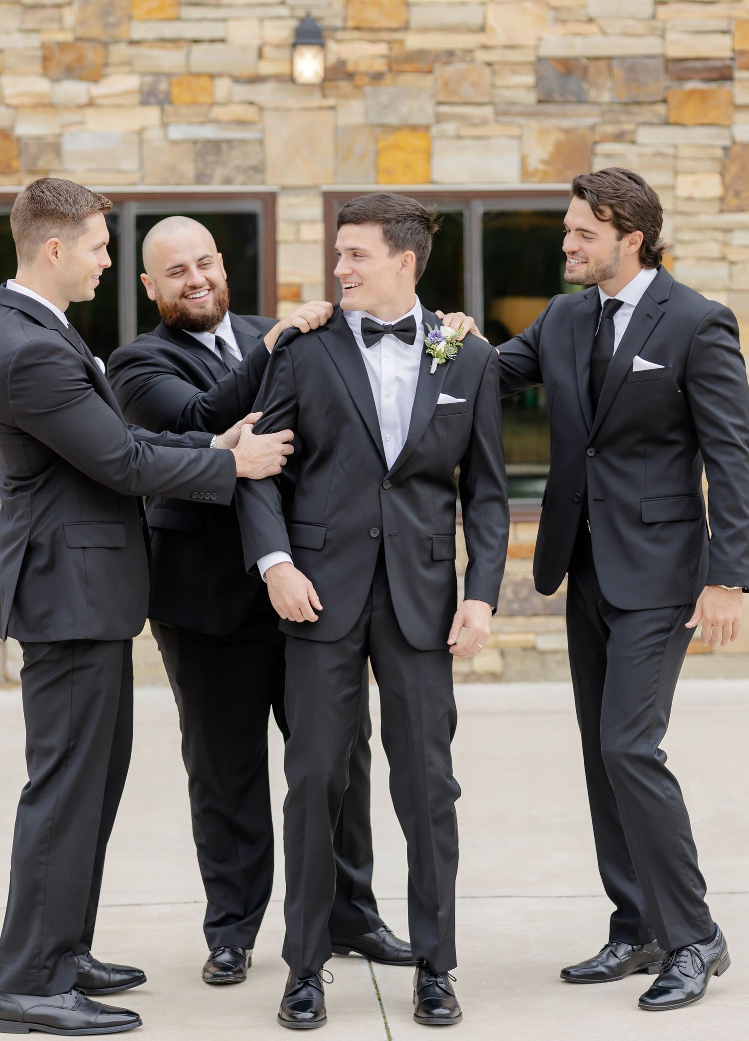 Creative photo sequence showing groomsmen's black dress shoes and socks at a wedding.