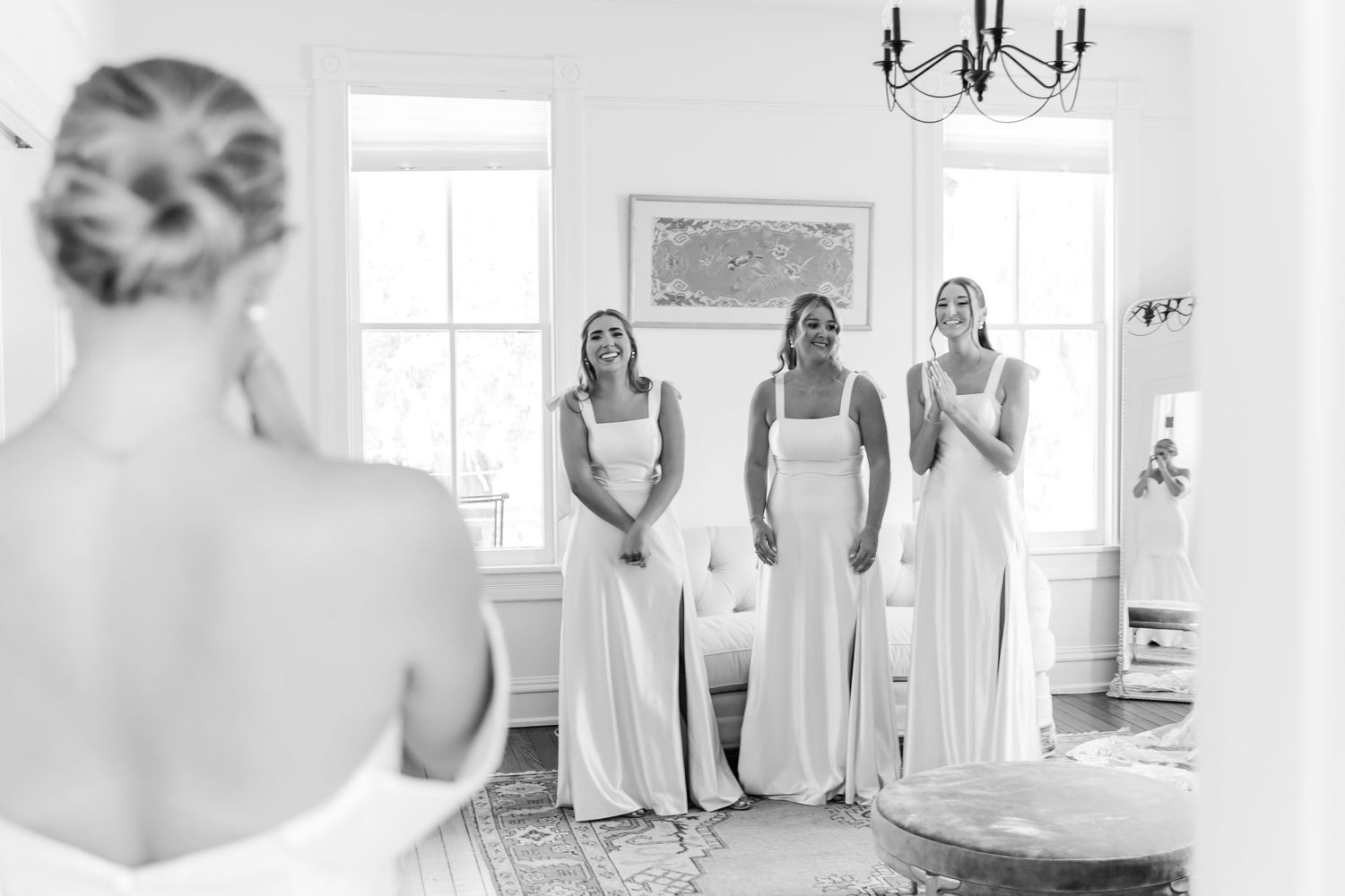 A series of elegant black and white wedding preparation photos showing bridal moments in bright interior spaces.