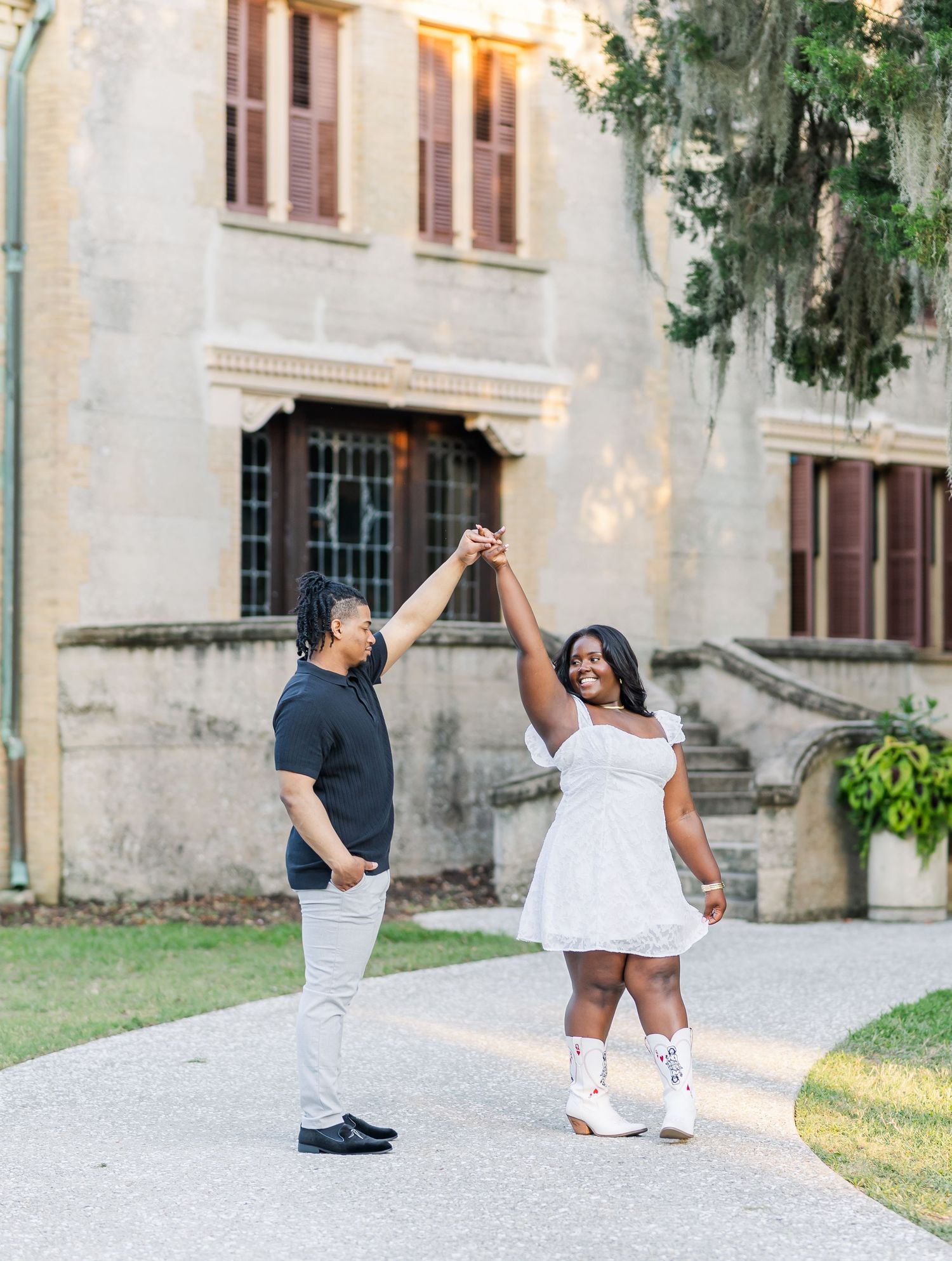 Playful dance poses captured in a series of photos outside a historic building.