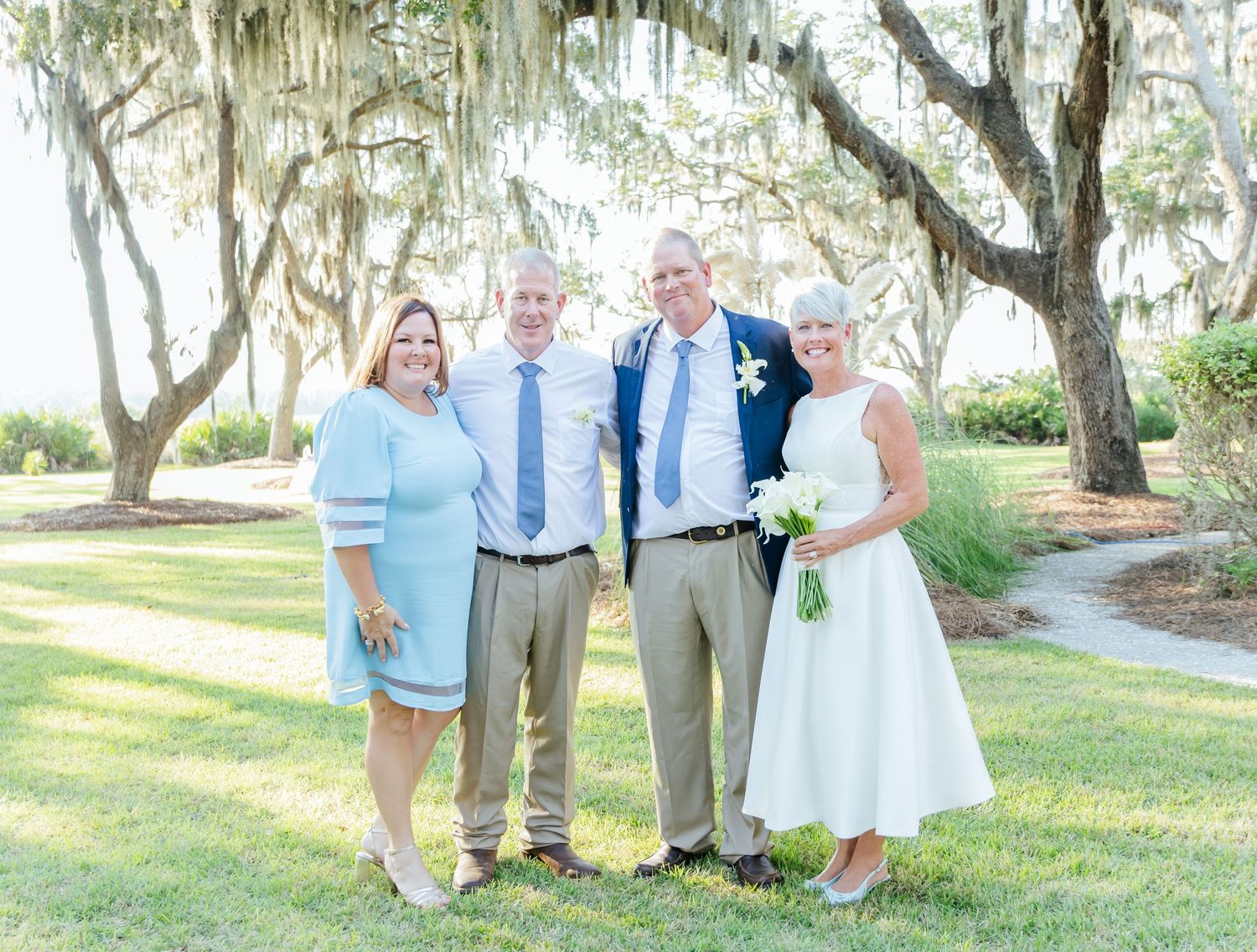 A series of outdoor wedding photos showing couples and groups celebrating in a scenic garden setting with trees and greenery.