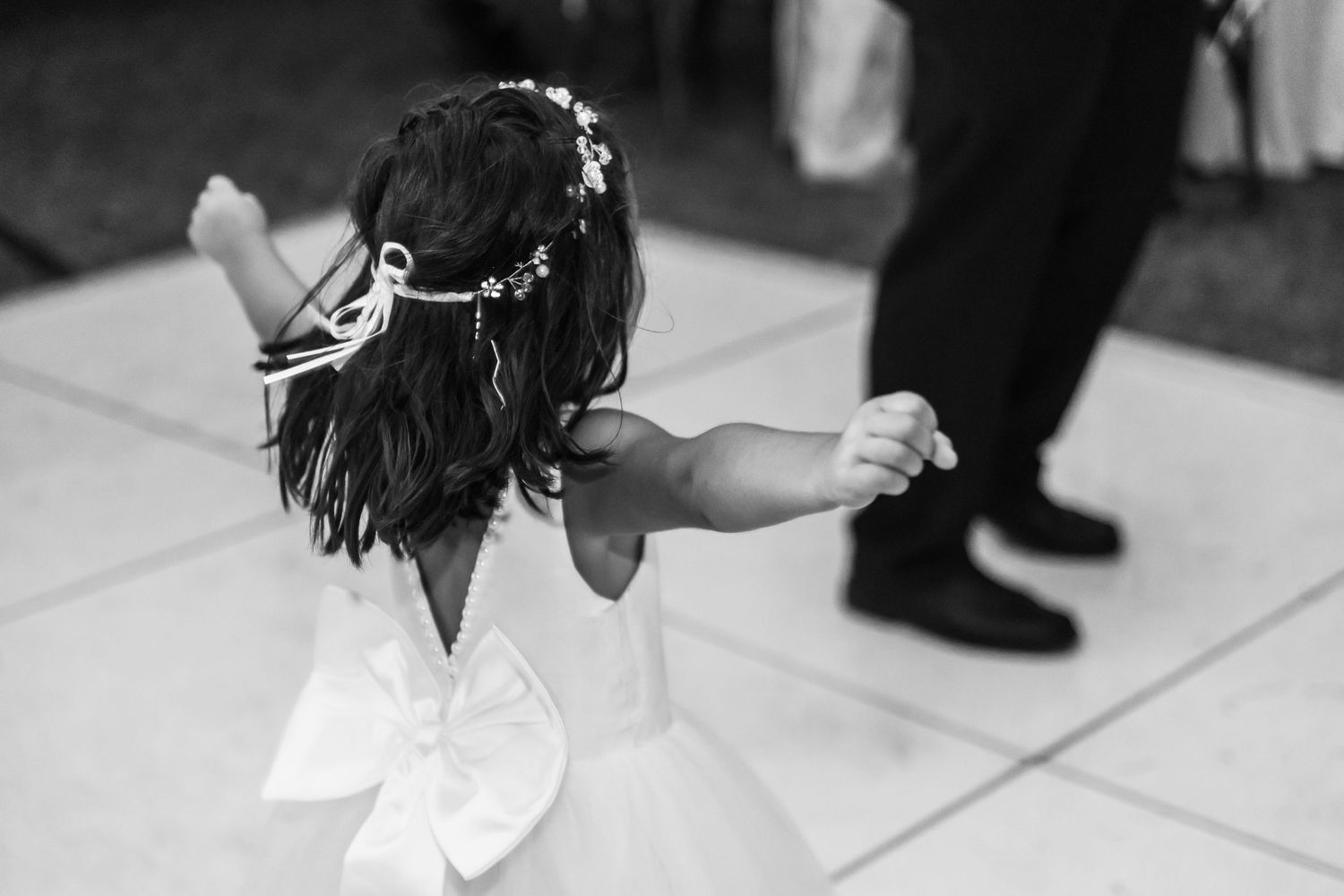 Couple dancing together during a romantic first dance at their wedding reception.