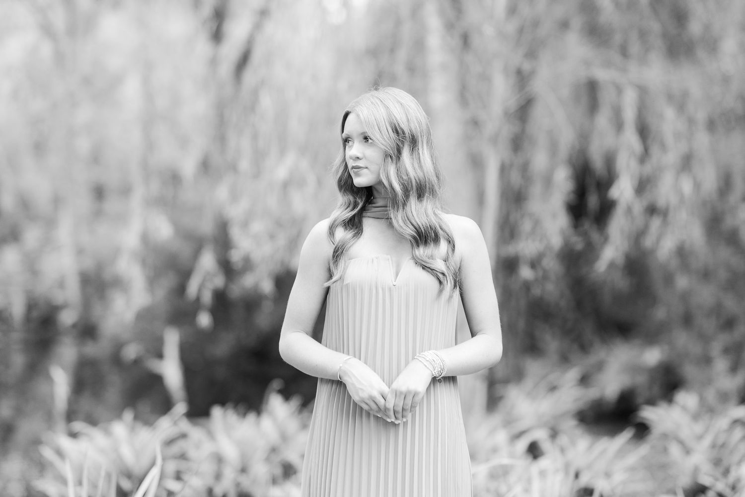 A collage of black and white outdoor photos showing someone in casual attire against a natural wooded setting.