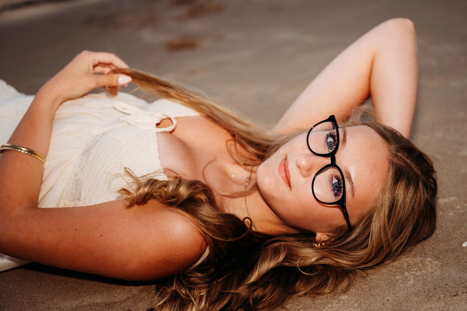 Multiple artistic portraits show someone reclining thoughtfully in an elegant setting.