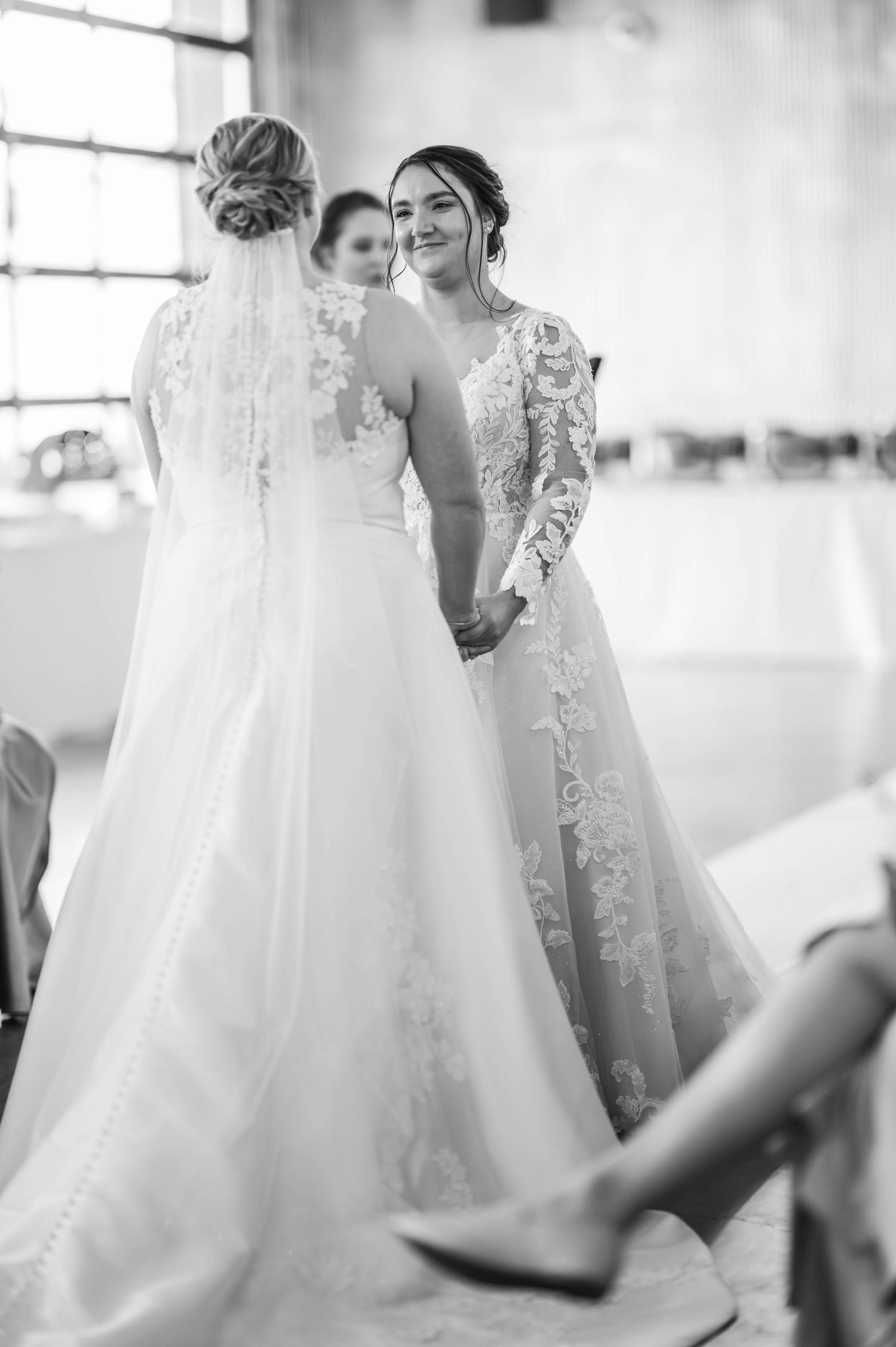 Black and white candid shots of wedding party members in flowing white gowns.