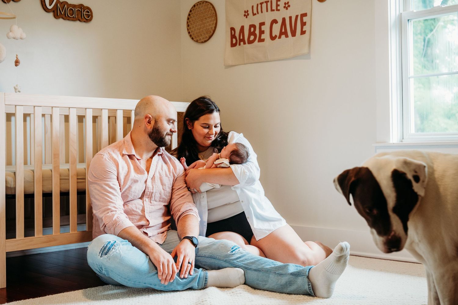 A series of tender moments between parents and baby in a cozy nursery with soft natural lighting and neutral decor.
