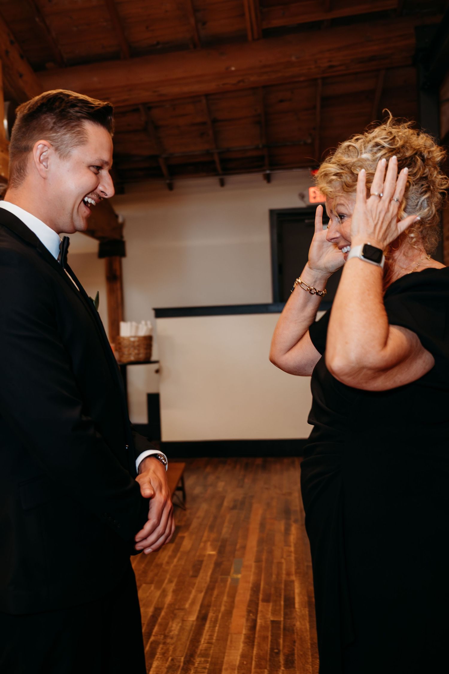 A series of romantic dance poses between a couple in formal attire on a wooden dance floor.