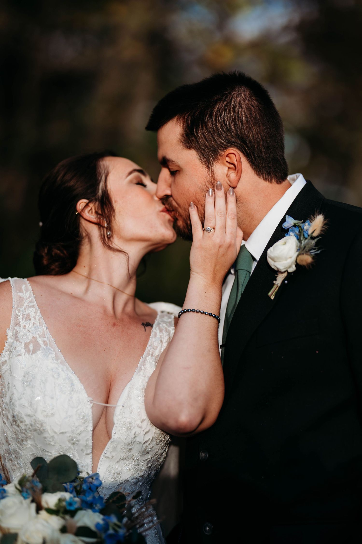 A romantic wedding kiss sequence showing four tender moments between the bride and groom in lace and formal attire.