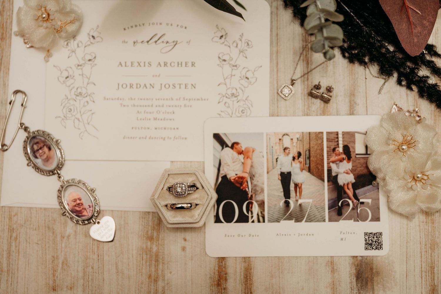 Vintage wedding invitations and paper decorations arranged in a soft beige and pink color palette.