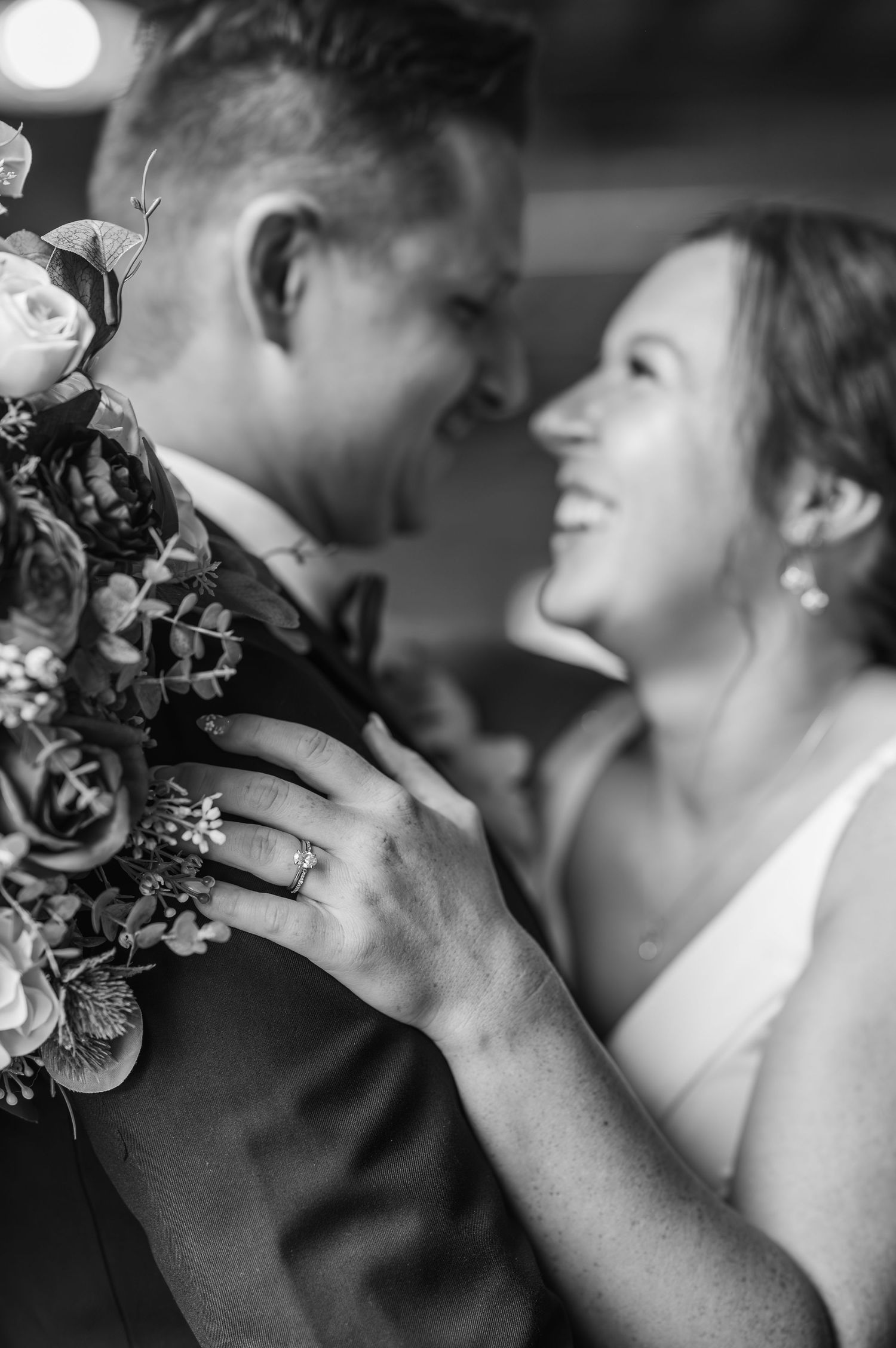 Black and white romantic wedding photo sequence showing intimate close-up moments between newlyweds.