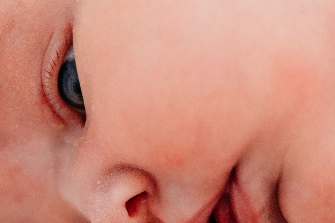 Close up macro shot of a human nose showing skin texture and pores.