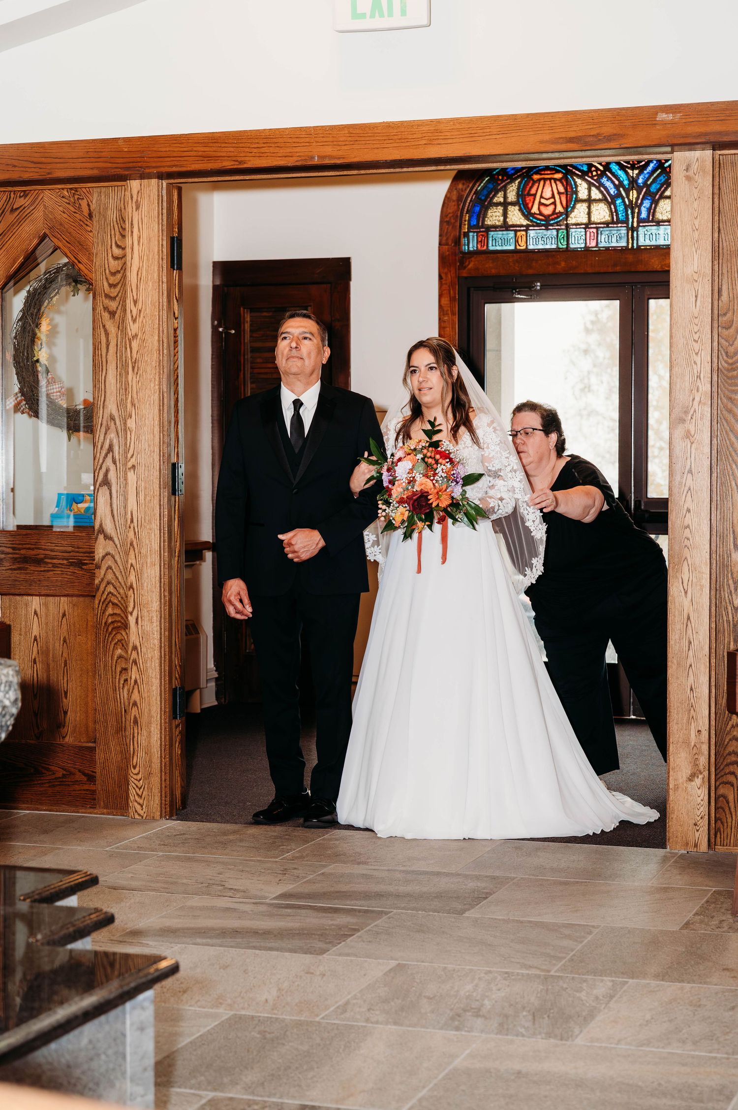 A wedding party walks through an elegant wood-paneled hallway in a sequence of five connected photographs.