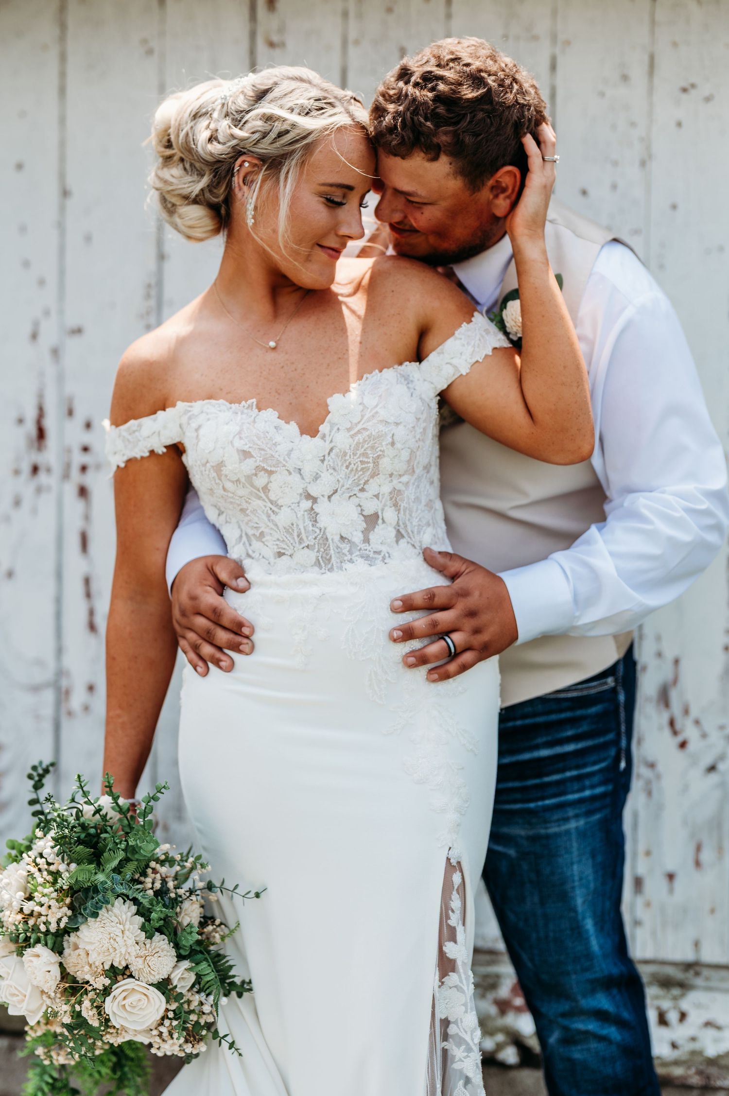 Intimate wedding portraits showing tender embraces between a couple in white dress and casual attire.