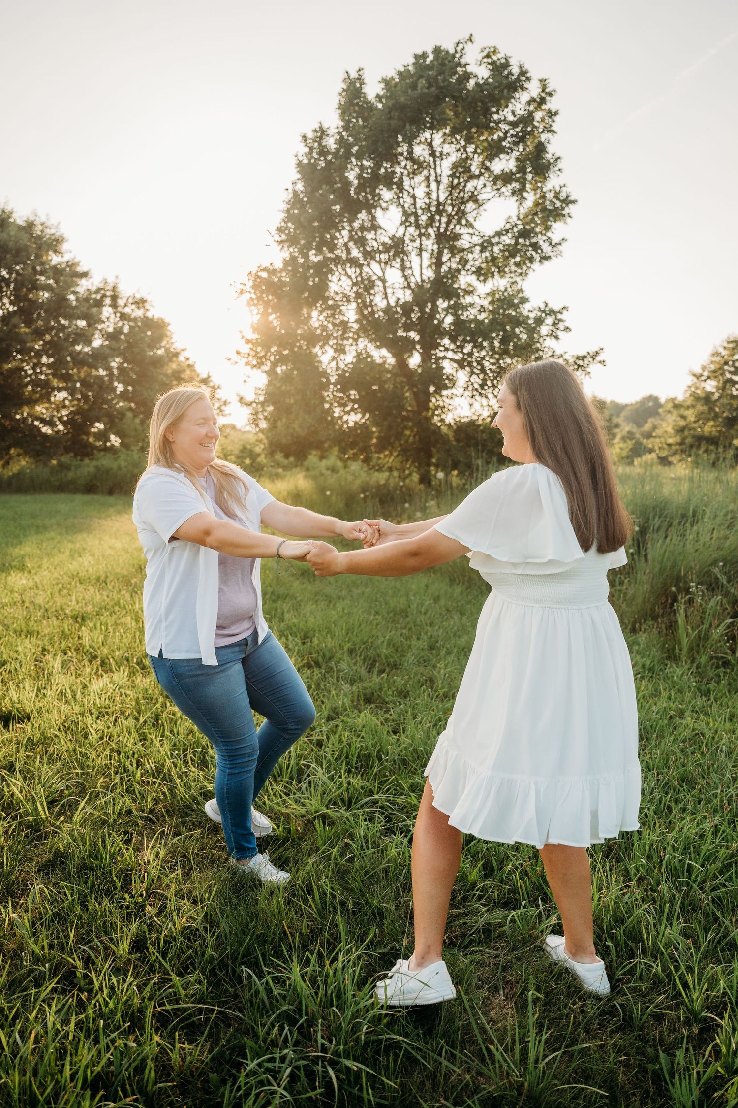 Dancing playfully in a sunlit meadow of tall grass during sunset.