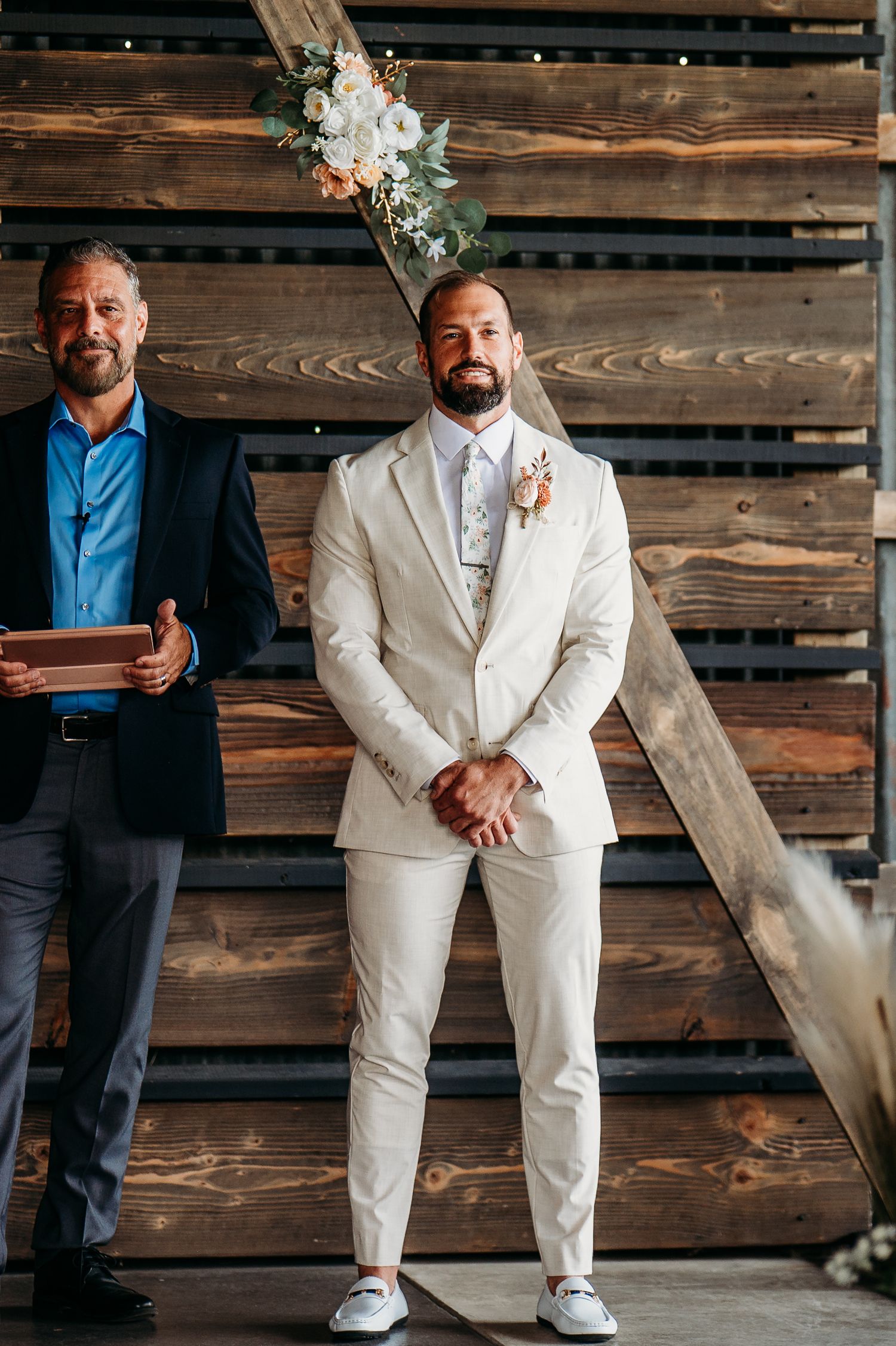 A series of candid poses against a rustic wooden wall backdrop showing white formal attire and casual footwear.