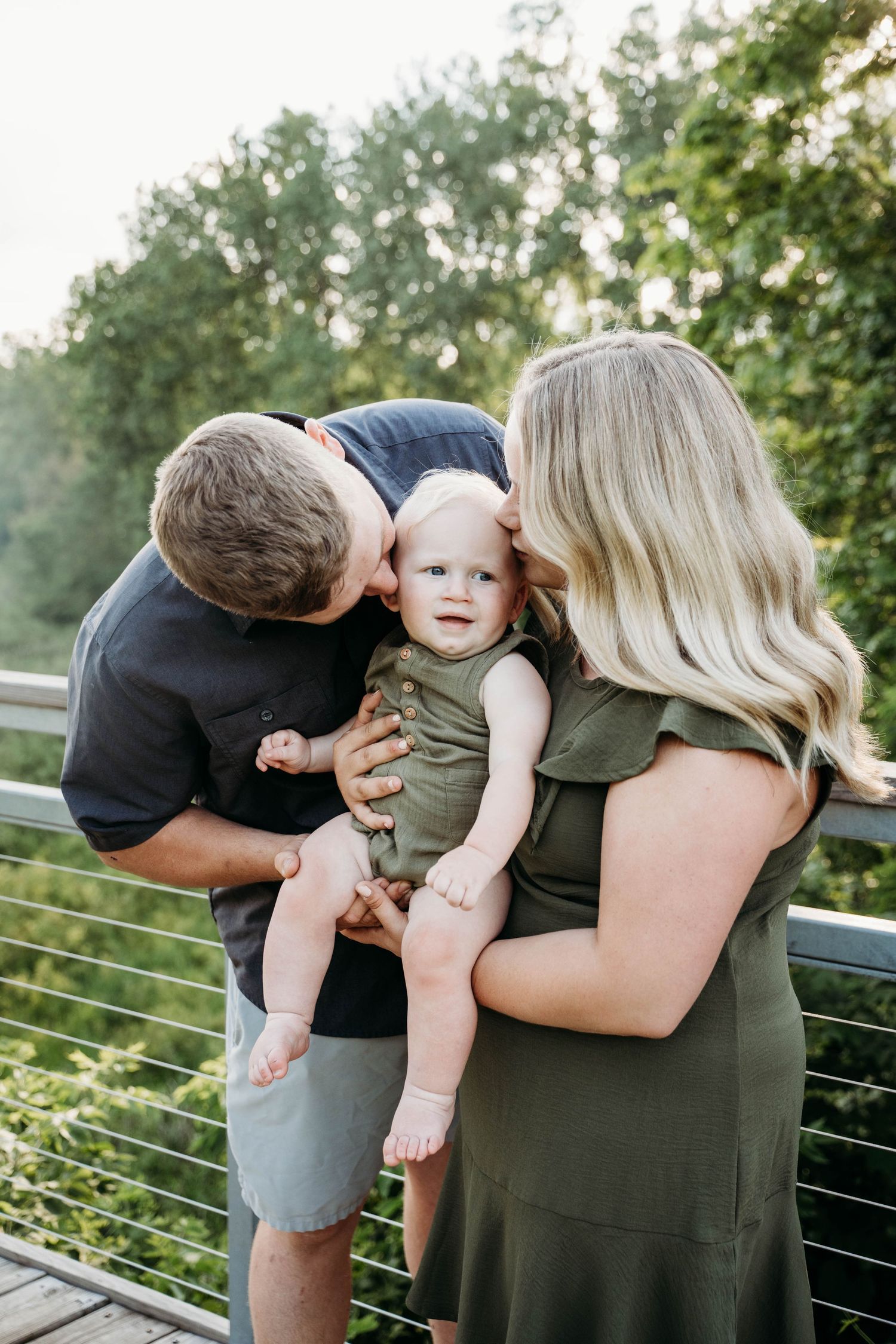 Family sharing a tender moment together on an outdoor deck.