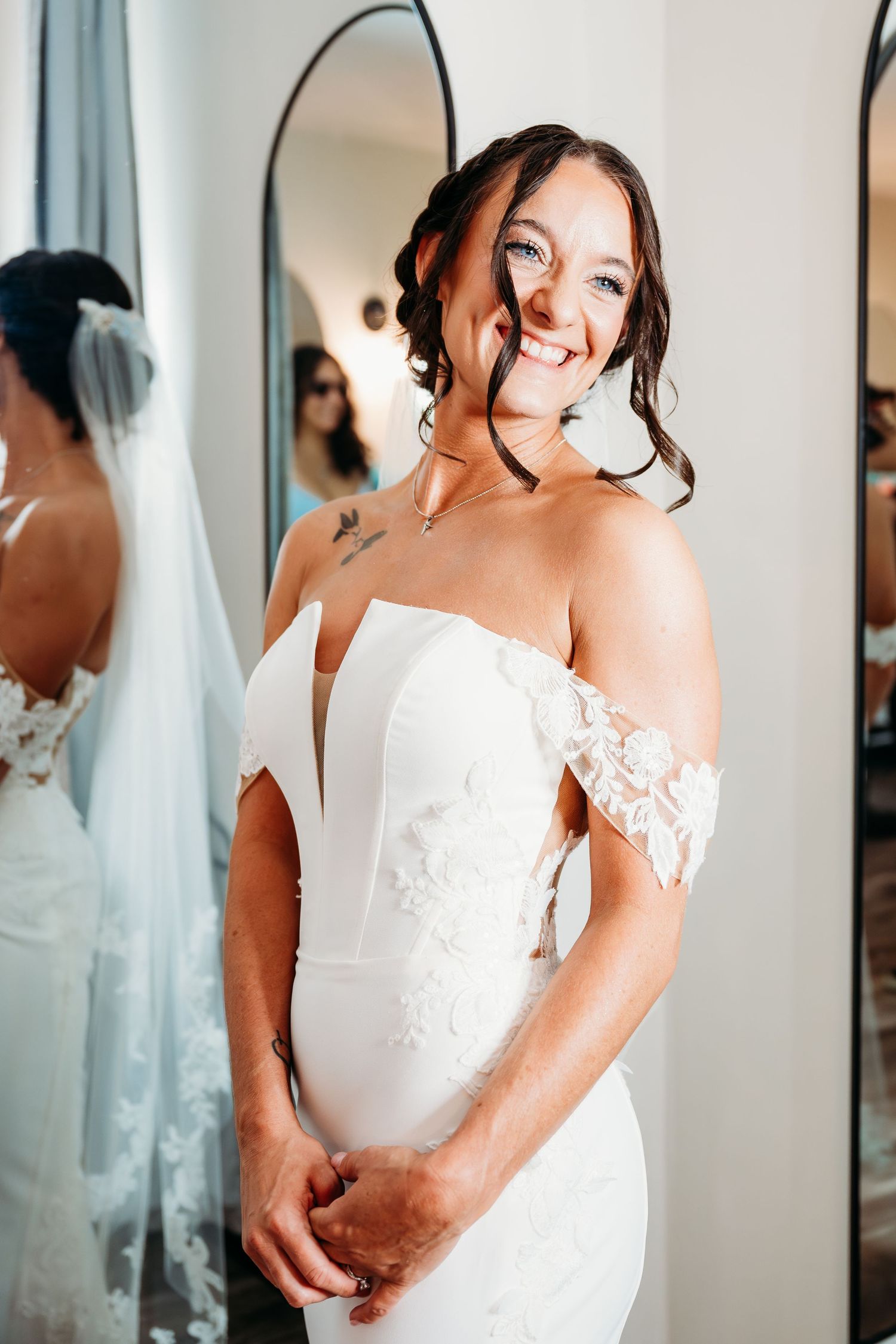 A sequence of bridal preparation photos showing close-up details of a white lace wedding dress in a dressing room.