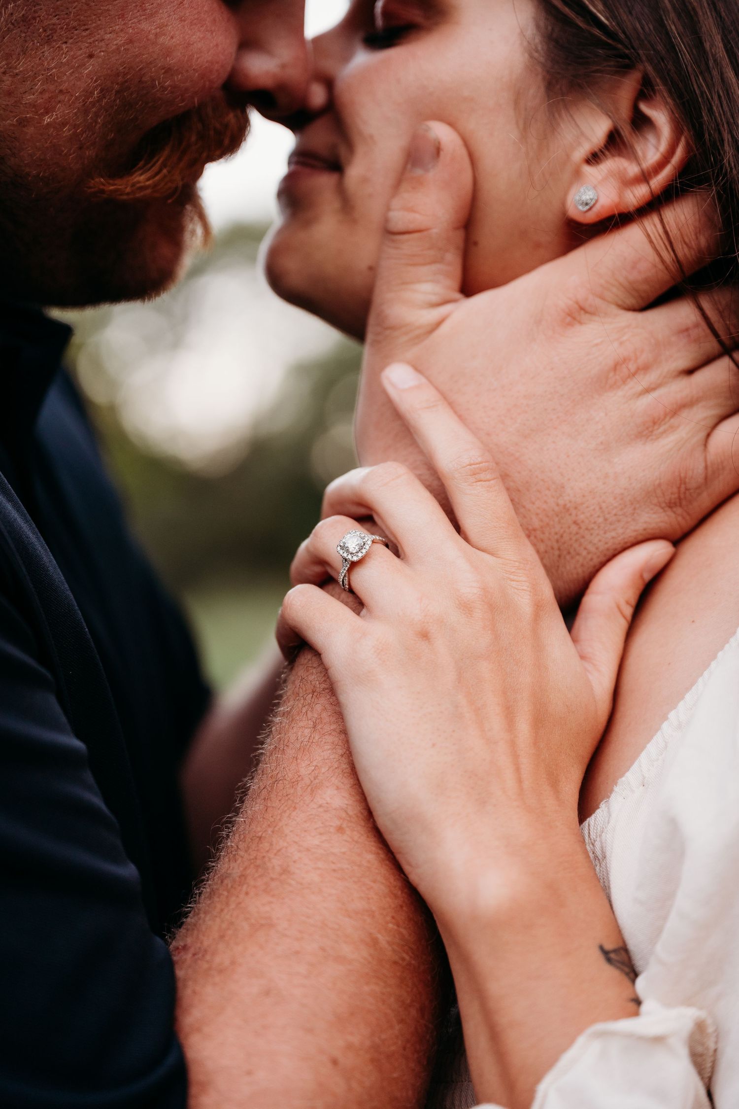 Close-up series of a romantic kiss between two people showing hands gently caressing faces.