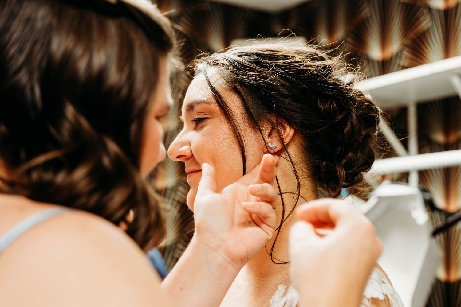 A close-up sequence of a romantic wedding kiss between a couple in formal attire.