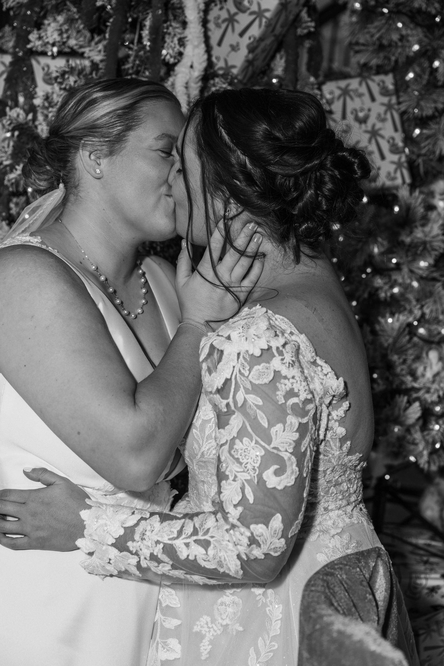 A series of intimate black and white wedding photos showing a tender embrace between two people in elegant attire.