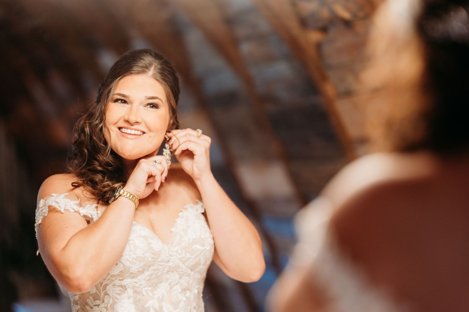 A beautiful wedding celebration captured in an elegant rustic indoor setting.