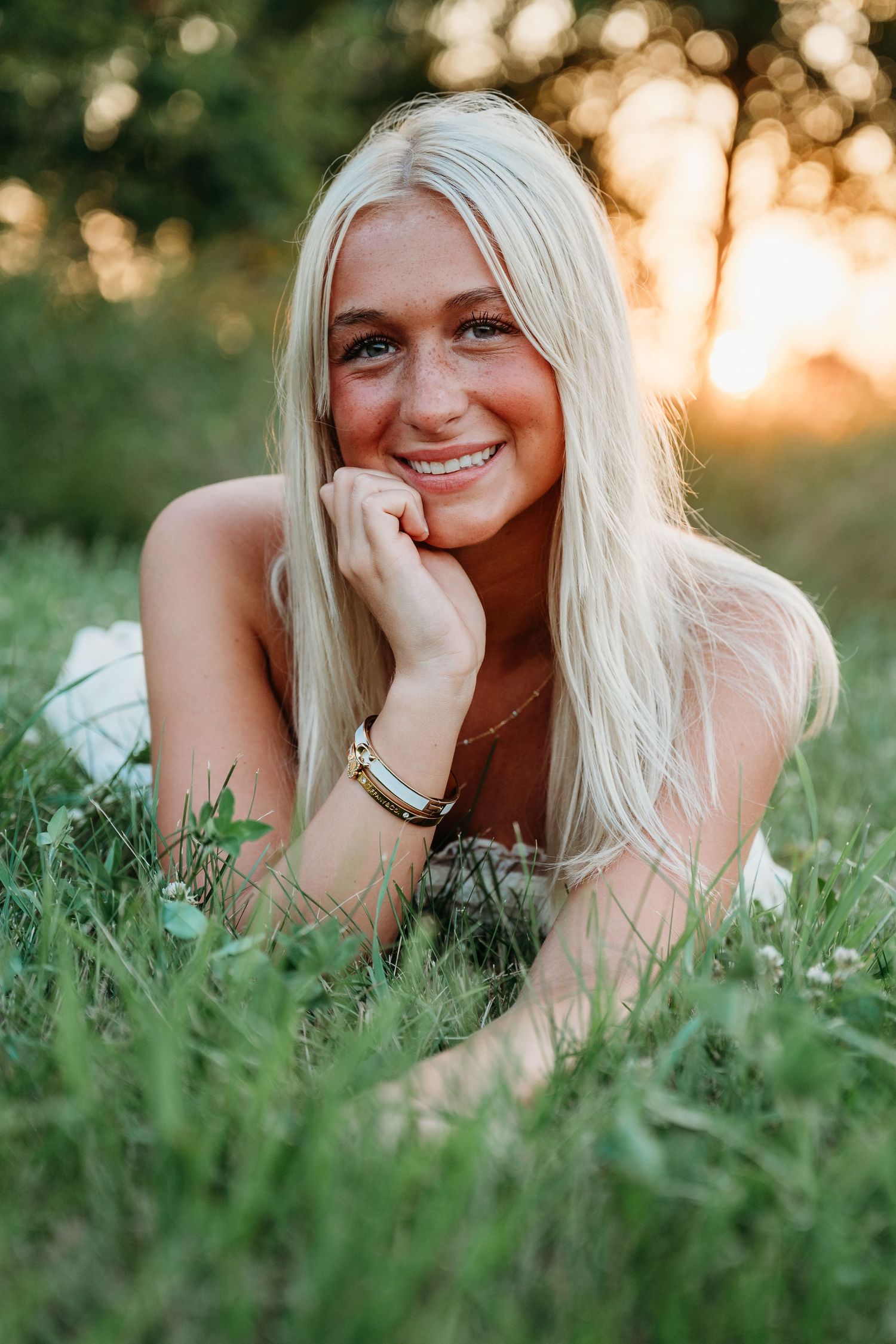 Candid portrait captured in a wildflower meadow during golden hour.