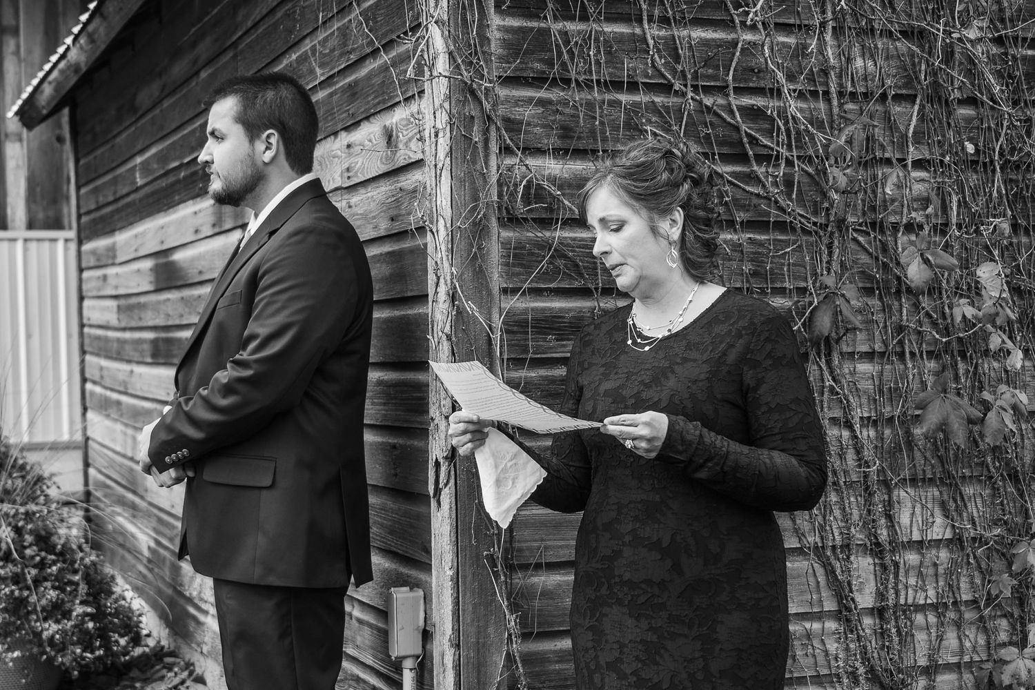 A sequence of black and white photographs showing people in formal attire exchanging documents outside a brick building.