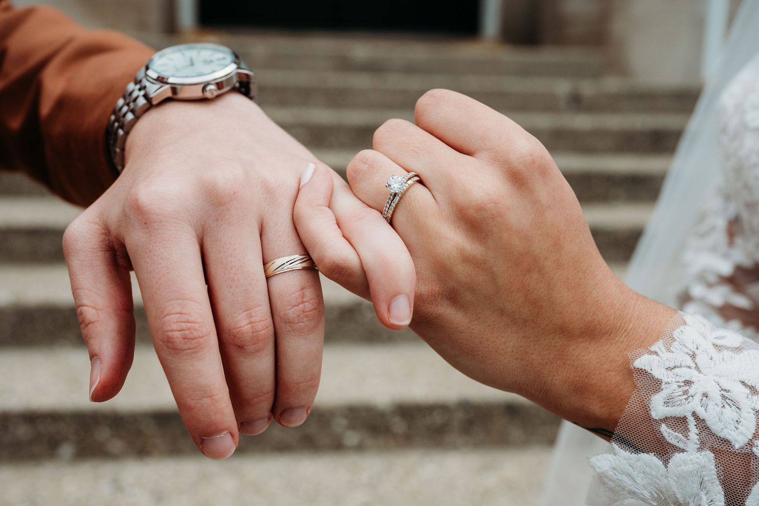 Wedding ring detail shots showing hands and engagement rings.