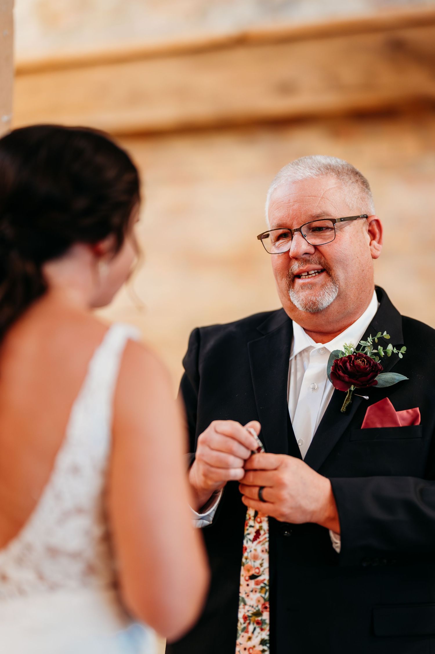 A series of emotional first look photos between a bride and father at a wedding.