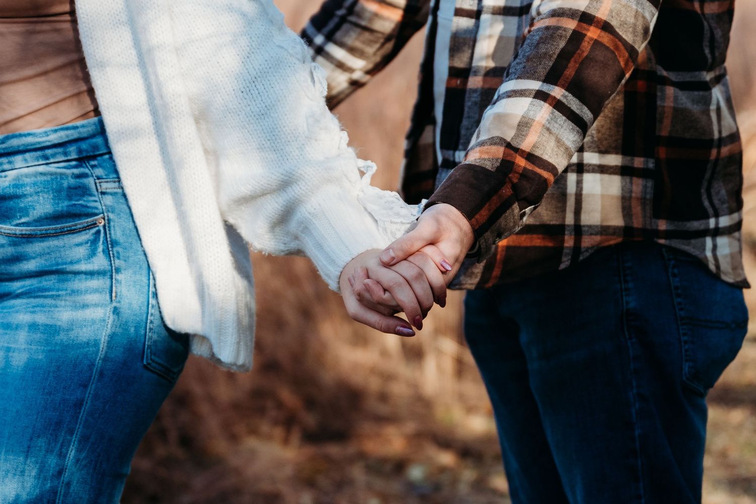 Close-up detail shots of people wearing blue jeans and white tops showing various poses and hand positions.