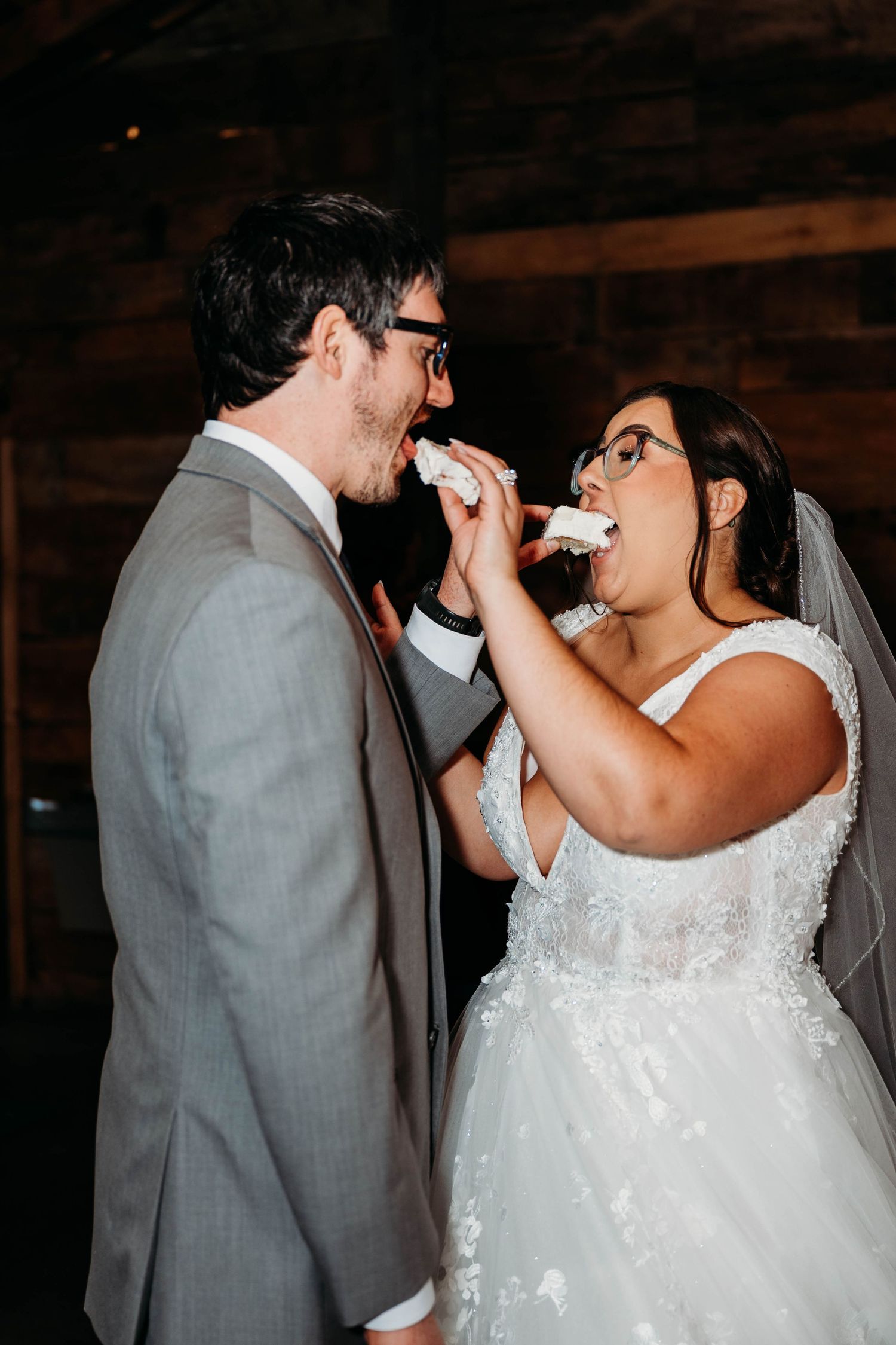 A bride and groom share a romantic moment drinking champagne together during their wedding celebration.