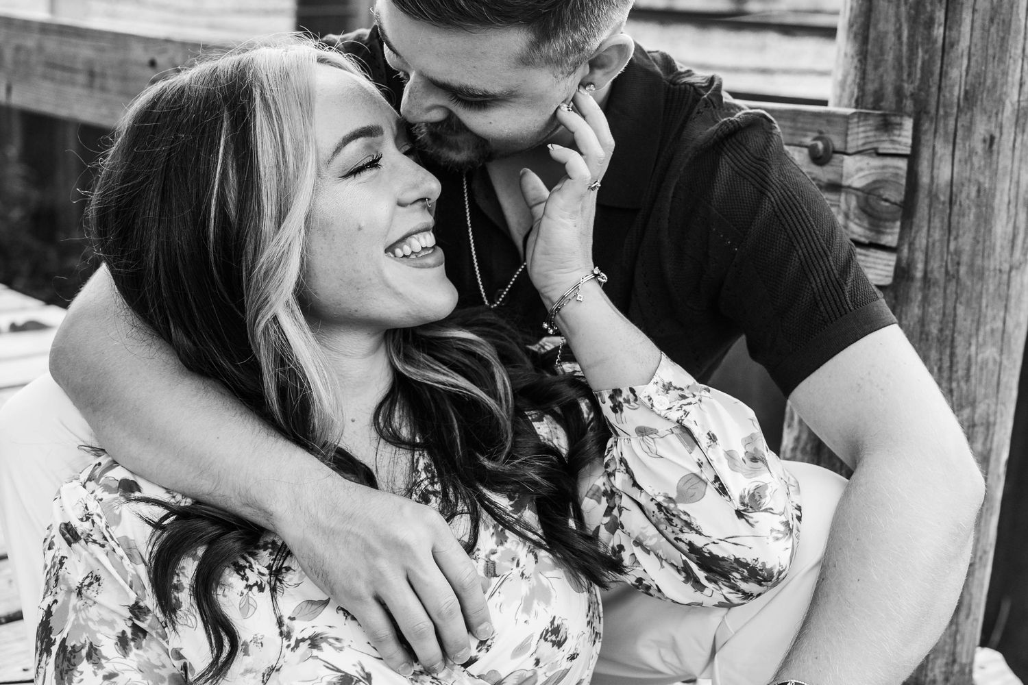 Black and white series of romantic couple portraits showing tender moments and laughter outdoors.