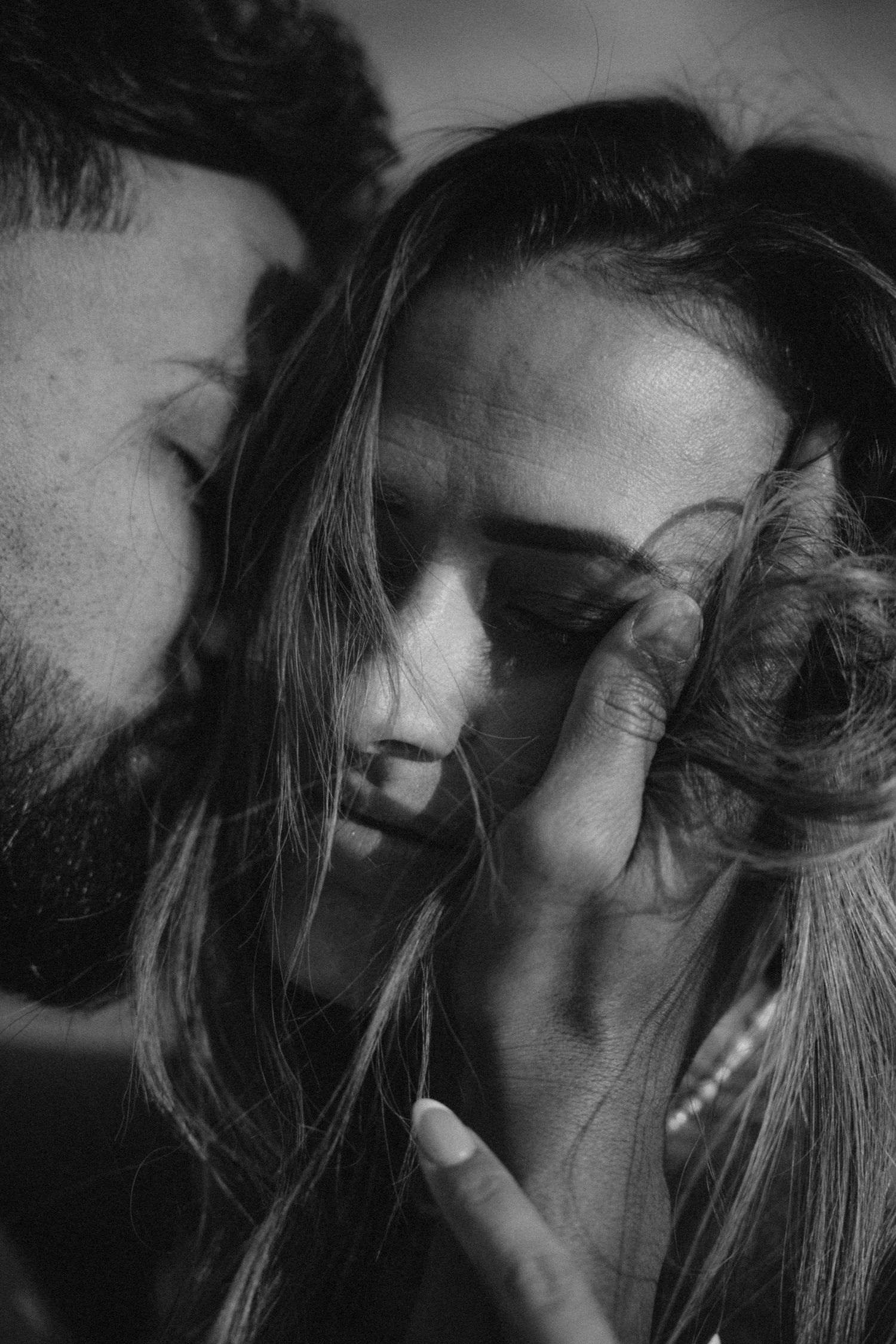 A romantic black and white photo series showing tender intimate moments between a couple.