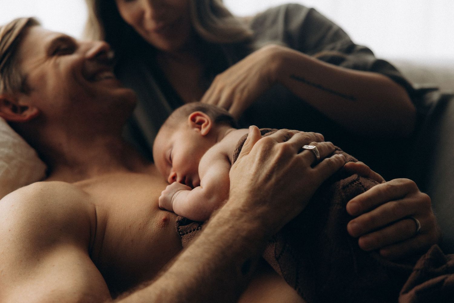 Close-up artistic portrait of an intimate moment between two people.