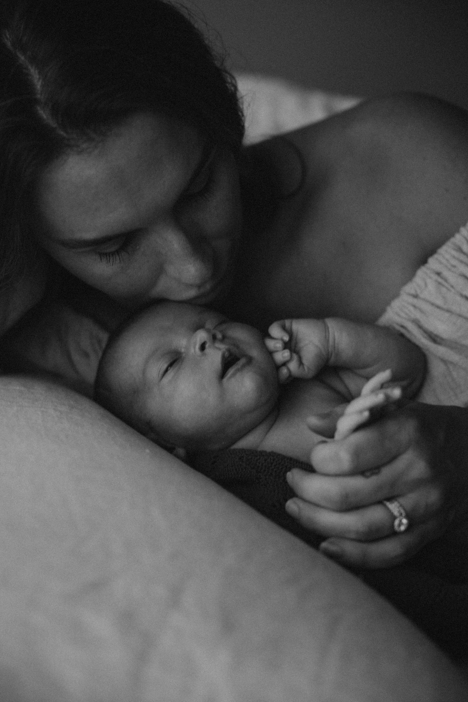 Intimate black and white photographs capturing quiet moments of connection.