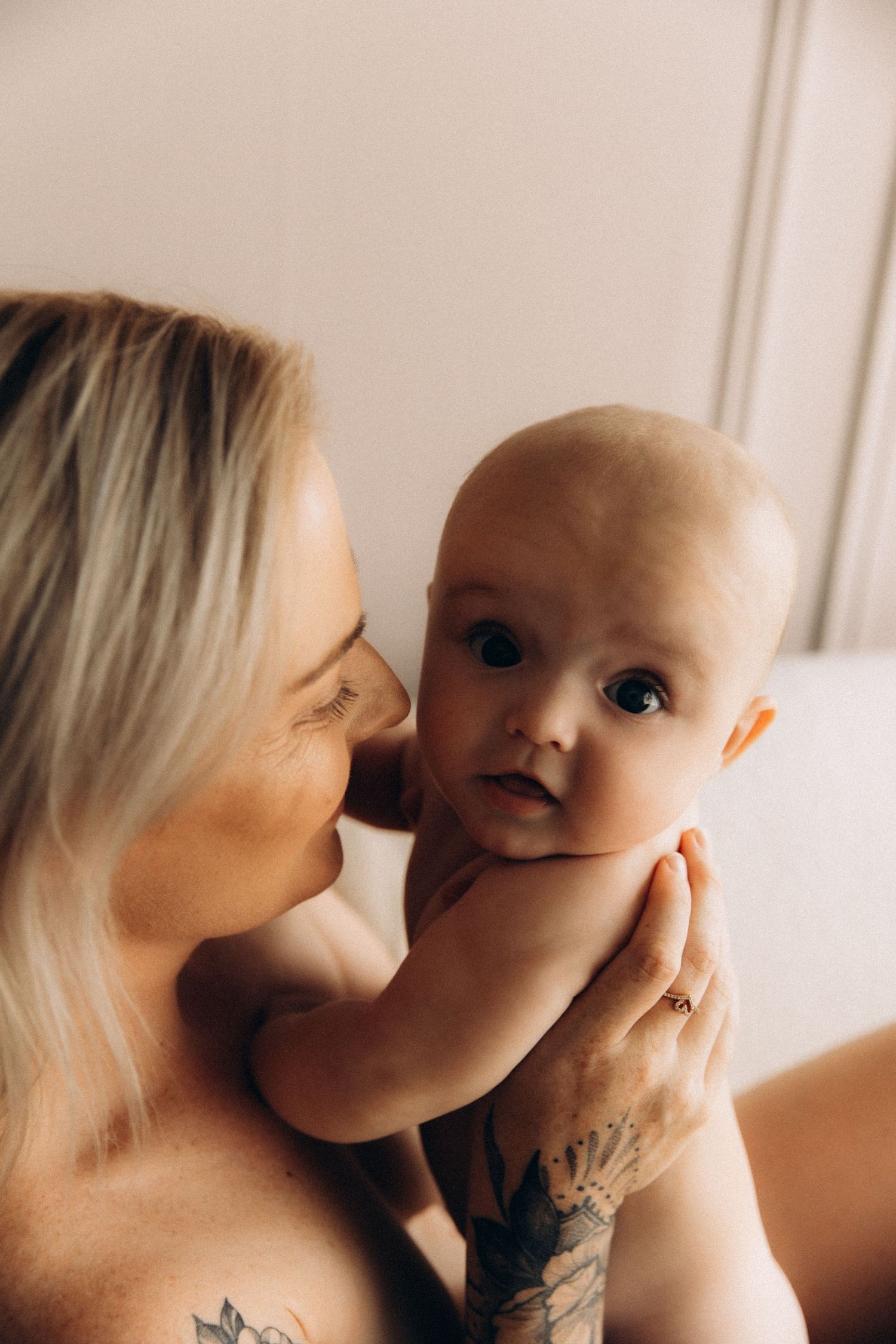 Intimate parent-child bonding moments captured in soft natural light.