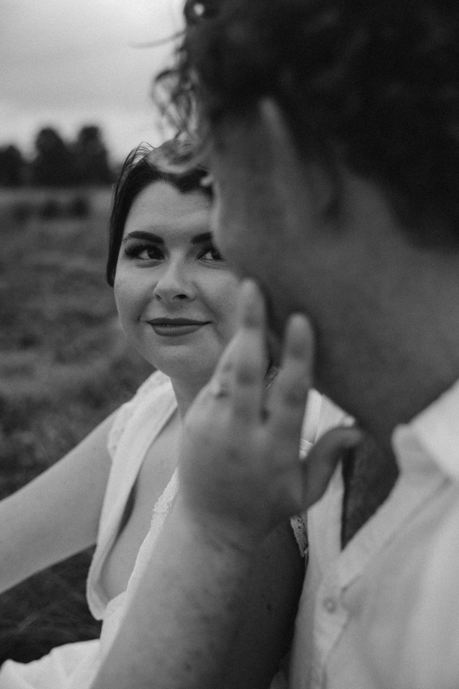 Black and white close-up of an intimate moment between a couple.