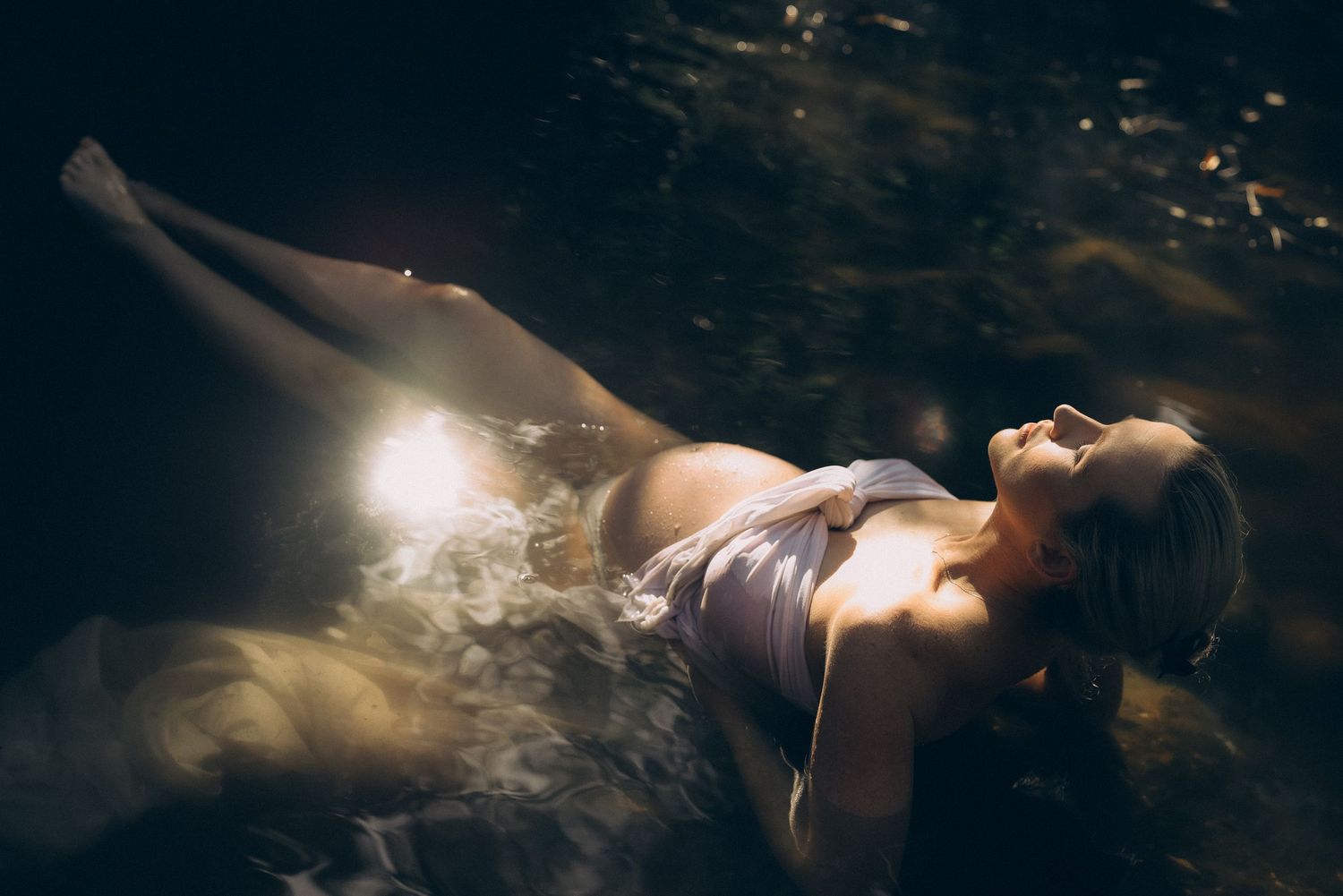 Artistic underwater photography with ethereal lighting effects.