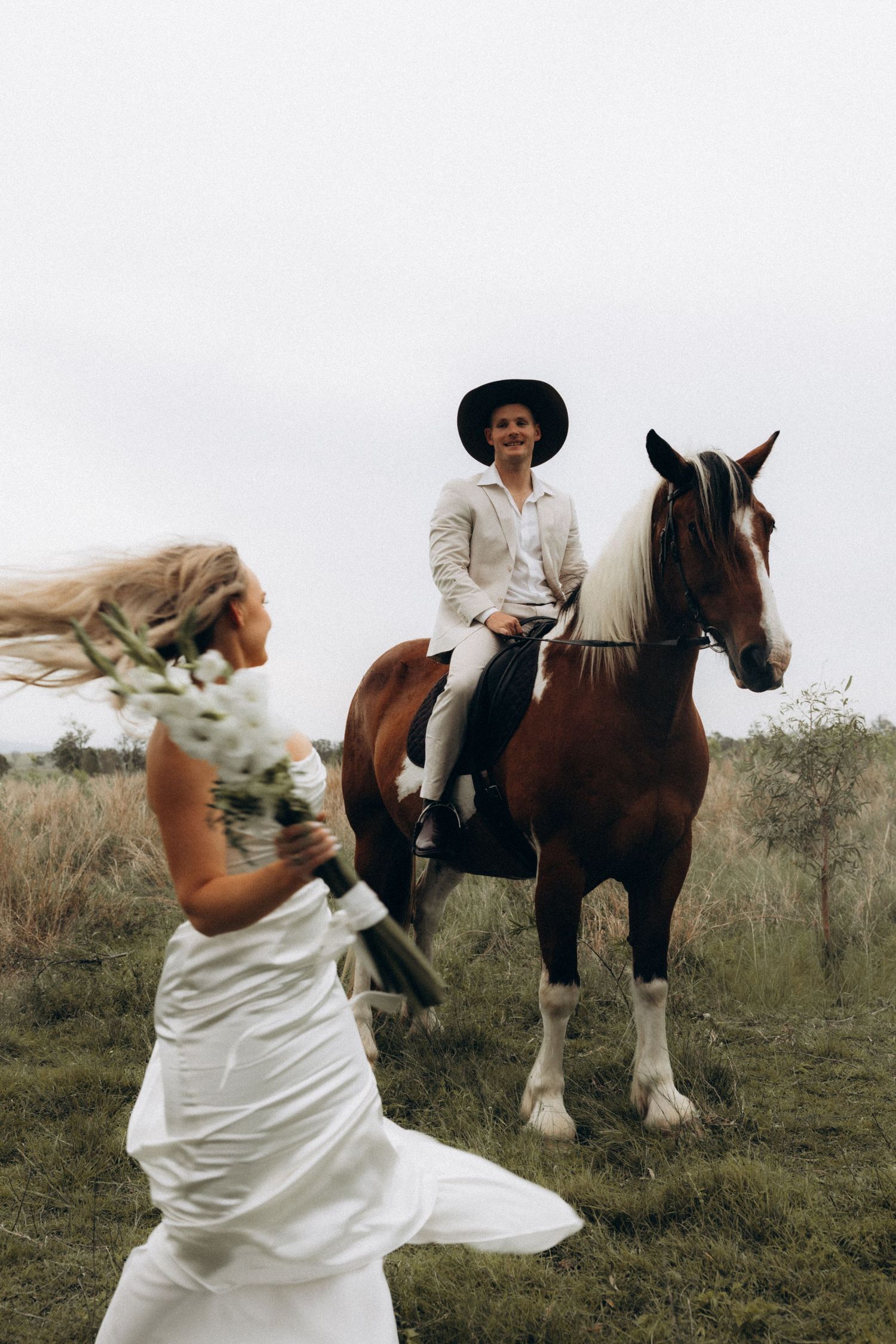 Playful wedding photo sequence with a couple and their horse in a field.